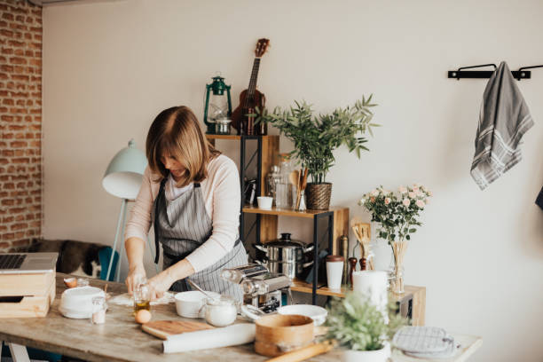 istock Mature woman mixing dough 649205302