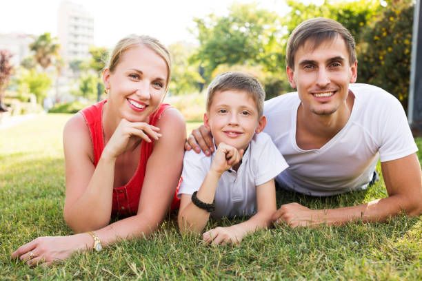 istock Family relaxing in park 649205648