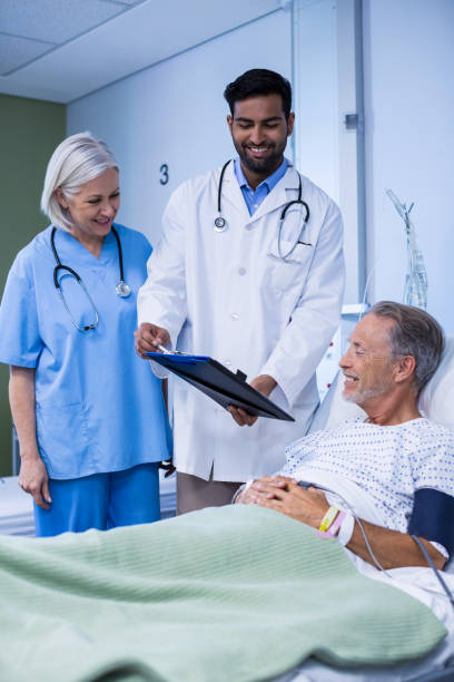 istock Doctor and nurse examining a patient 649210474