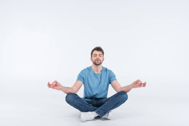 istock relaxing man sitting on floor on white 649210528