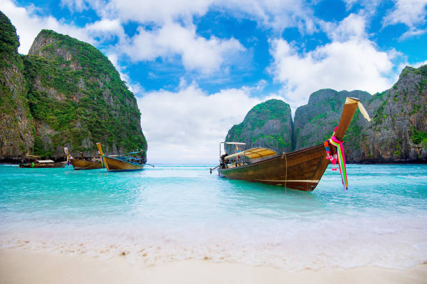istock Long boat and blue water at Maya bay in Phi Phi Island. 649219676