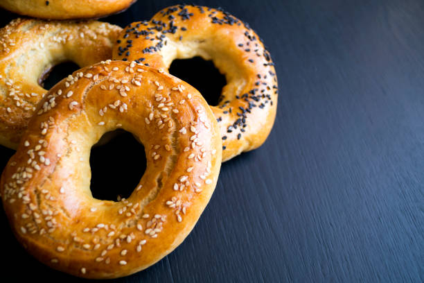 istock bagels with sesame seeds on a black background 649220042