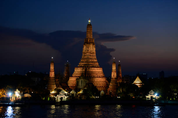 the temple of Wat arun at the Chao Phraya river in the city of Bangkok in Thailand in Southeastasia.
