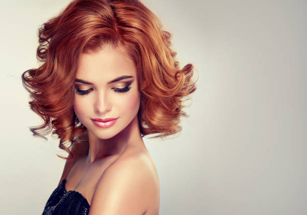 istock Beautiful model brunette with middle length curled hair and bright make up. 649232616