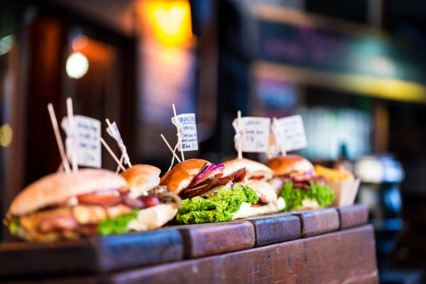 istock Freshly flame grilled burgers displayed in a row 649239234