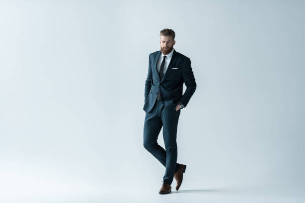 istock Confident bearded businessman in stylish suit standing 649242862
