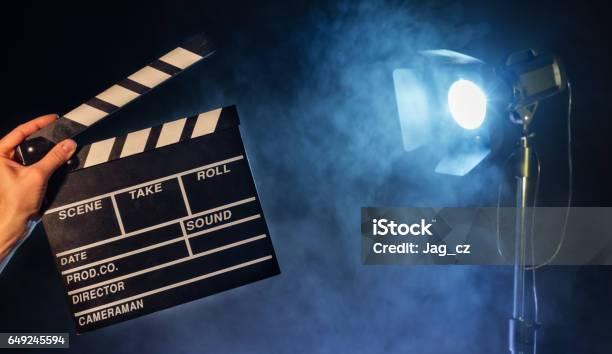Operator Holding Clapperboard Studio Light On Background Stock Photo - Download Image Now