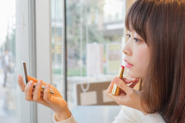 istock Young woman making up in the room 649248418
