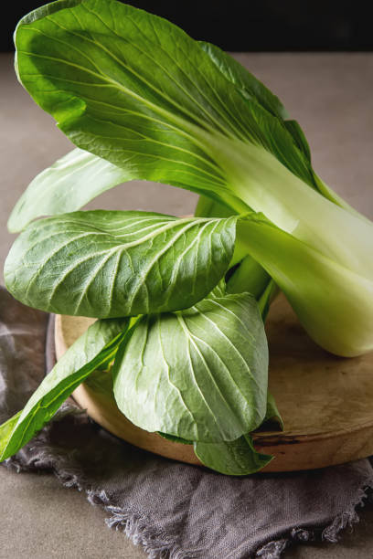 istock Overhead shot of Chinese cabbage, Bok Choy, on rustic background 649248424