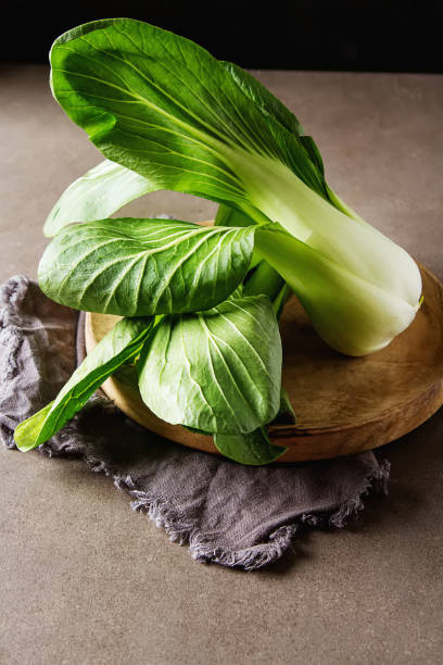 istock Overhead shot of Chinese cabbage, Bok Choy, on rustic background 649248522