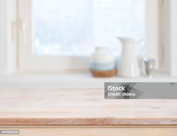 Wooden Table Top On Blurred Kitchen Window Background Stock Photo - Download Image Now