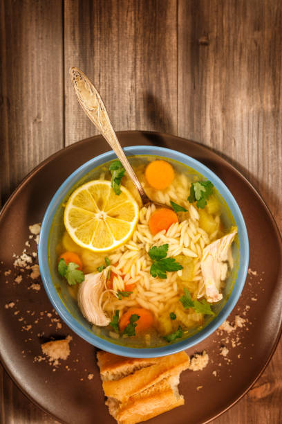 istock Bowl of Lemon Chicken Orzo Soup Rustic Style 649270838