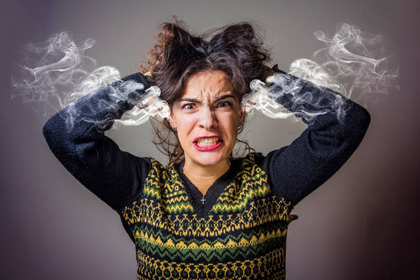 istock Angry woman steaming with rage 649274360