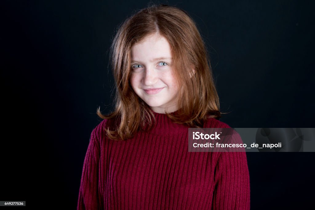 Smiling redhead girl 12-13 Years Stock Photo