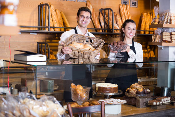 istock staff offering fancy and cakes 649277642
