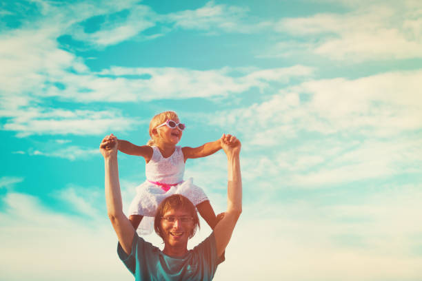 istock Father and little daughter play at sky 649281540