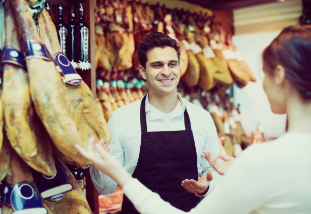 istock Brunette choosing iberico and serrano 649281770