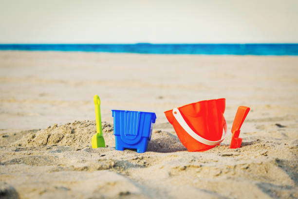 istock kid toys on tropical sand beach 649281830