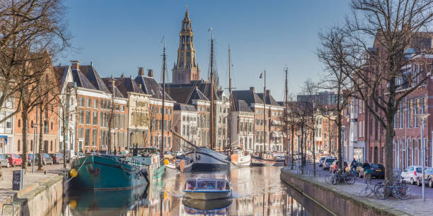 Panorama of a cruiseboat in a canal in Groningen, The Netherlands stock photo