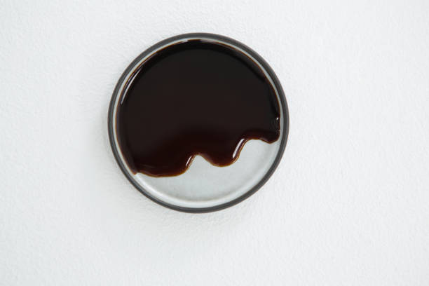 istock Chocolate syrup on plate against white background 649282682
