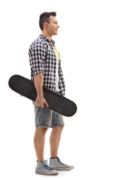 istock Skater holding a skateboard and waiting in line 649285524