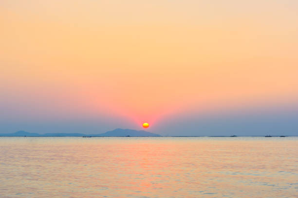istock Boat and the beach with sunset background 649289308