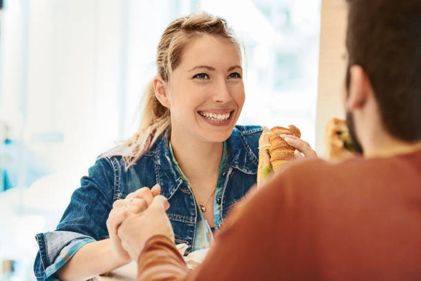 istock Couple eating sandwiches 649290366