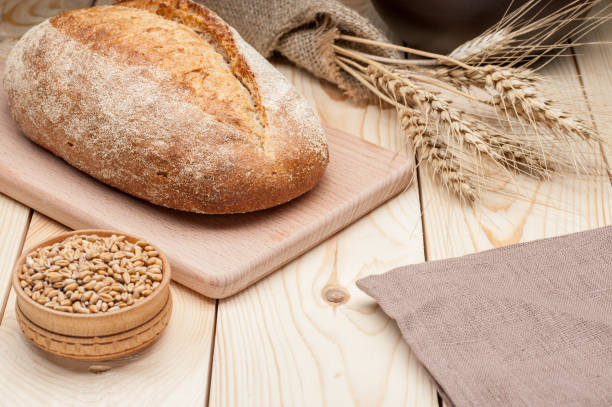 istock loaf of bread on wooden table 649299044