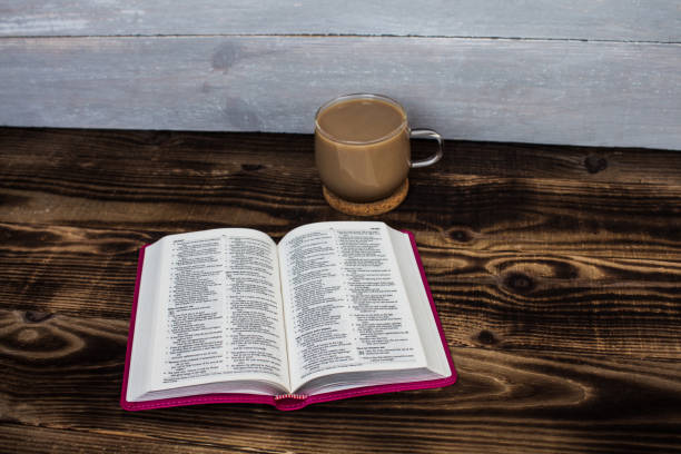 istock bible and coffee with milk on wooden background 649299856
