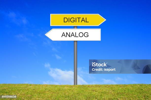 Signpost Showing Analogue And Digital German Stock Photo - Download Image Now - Analog, Directional Sign, Road Sign