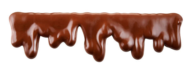 istock Melted chocolate syrup is dripping. Streams with drops isolated on white. With clipping path.