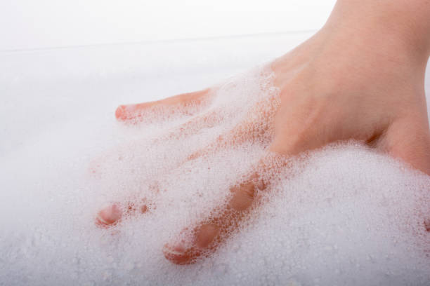 istock Child washing hands  in foam 649314078