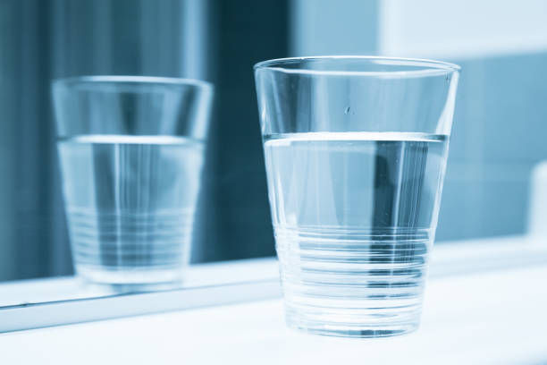 istock Glass of water stand, blue toned filter 649315066
