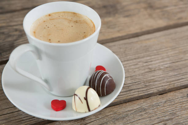 istock Cup of coffee with chocolate and confectionery 649315182