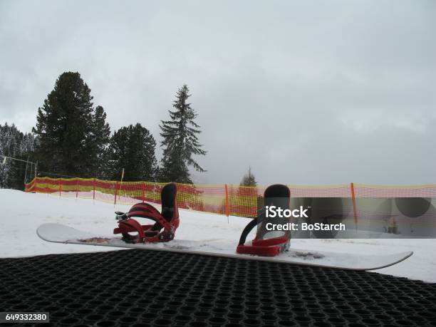 Snowboard With Bindings Put On Step With Snow Mountain View Stock Photo - Download Image Now