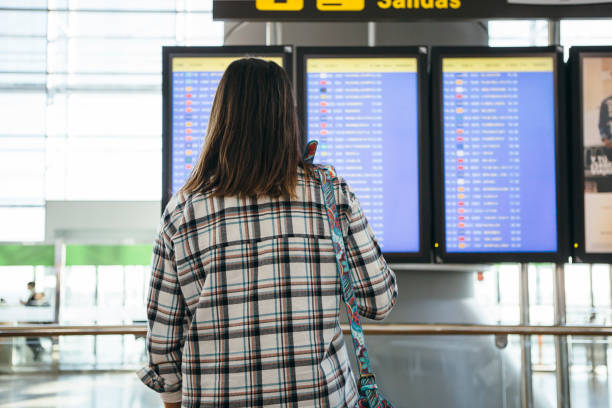 istock Woman checks her flight 649335718