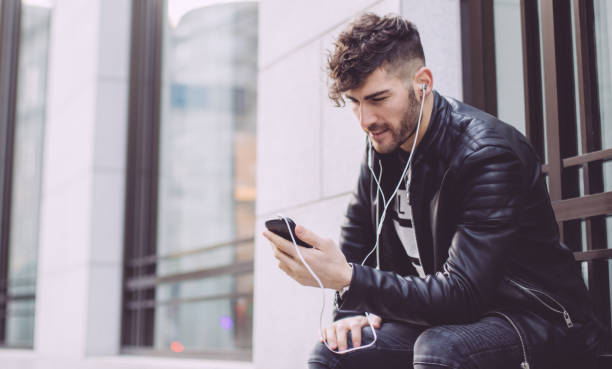 istock Guy listening music on headhpones 649340490