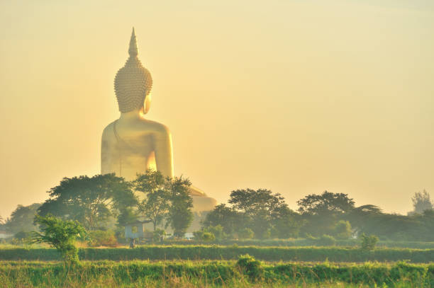 golden budha thailand with blue sky at wat muang thailand
