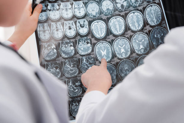 istock kids doctors in medical uniform examining x-ray image 649351272
