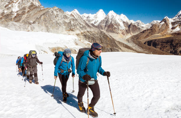 istock Group of Climbers walking on Glacier in high Mountains 649352388