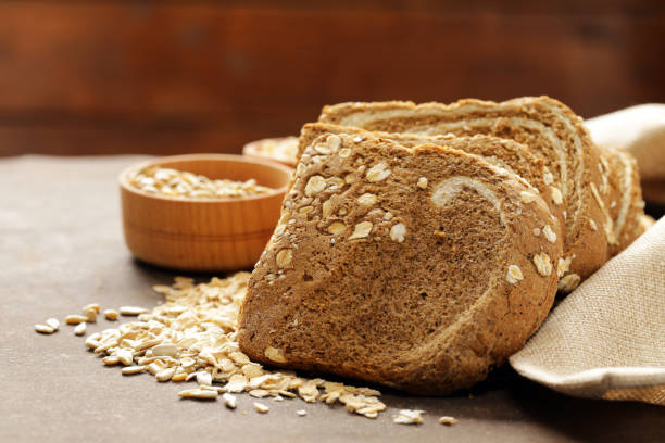 istock Whole grain bread with oat flakes and seeds 649355178