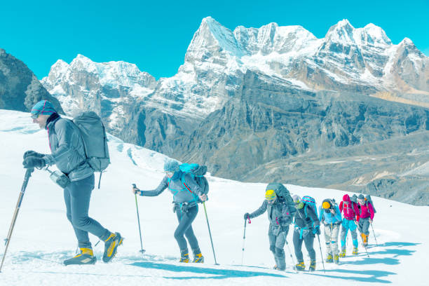 istock Soft toned Image of Mountain Climbers passing by on Glacier 649356320