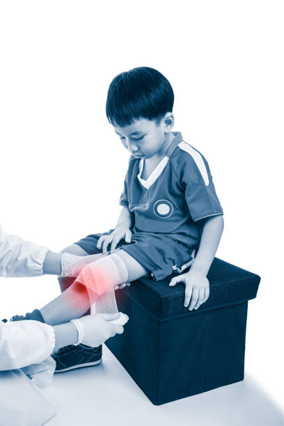 istock Doctor makes bandage on knee patient, on white background. 649360450