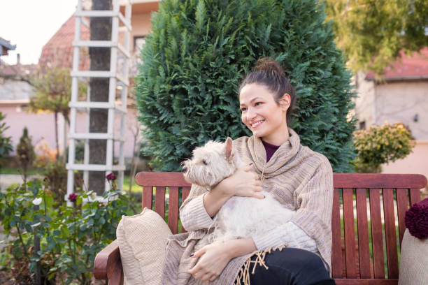 istock Beautiful young woman with dog 649364122