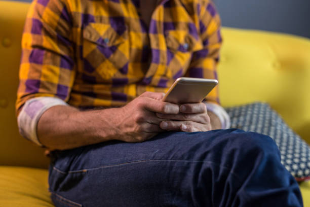istock Close up of handsome man using his phone , studio shoot 649366268