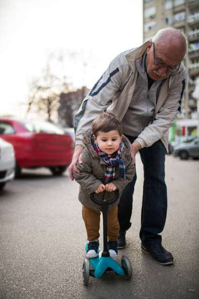 istock Grandpa ,me and a scooter 649367144