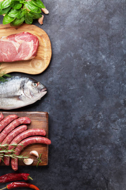 istock Sausages, fish and meat cooking 649370398