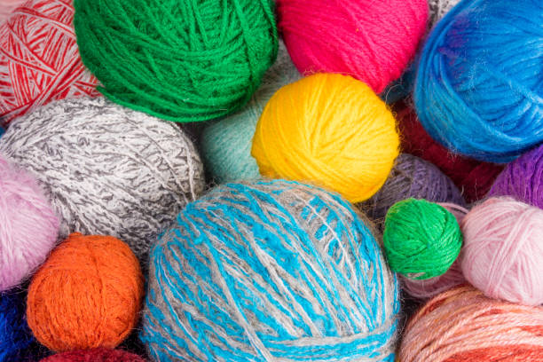 istock wool yarn ball. Colorful threads for needlework. Colorful fabric texture background 649373428