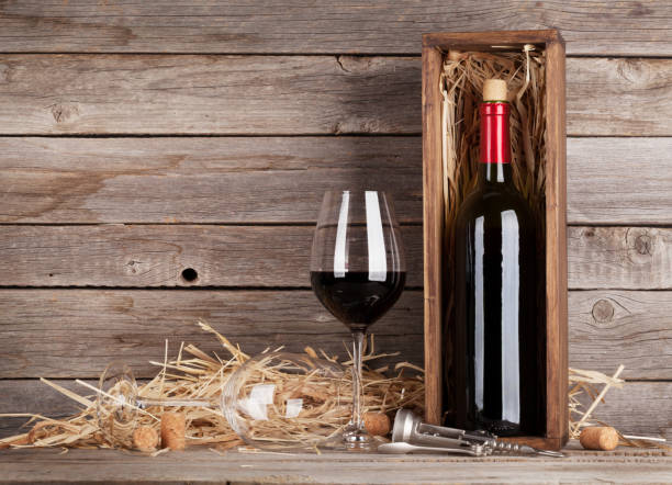 istock Red wine bottle and wine glasses 649373662