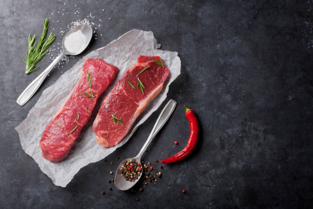 istock Raw striploin steak with rosemary 649376680
